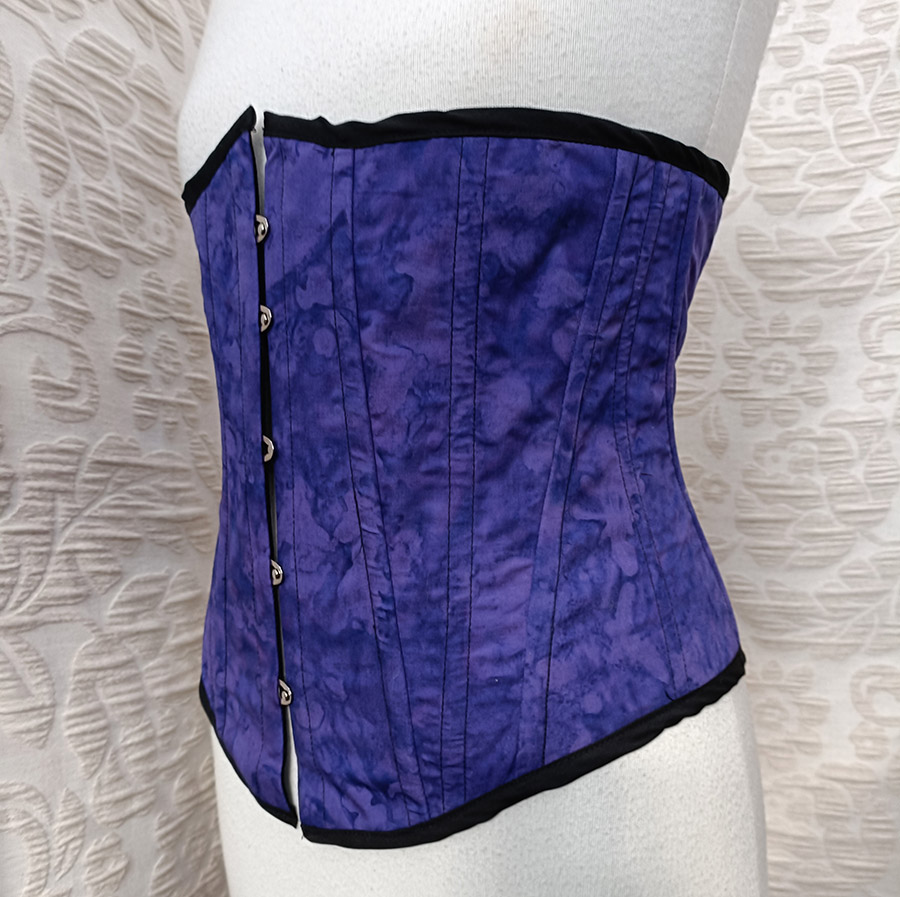 A men's corset in purple made by Velvet Cherry in Wellington, New Zealand.