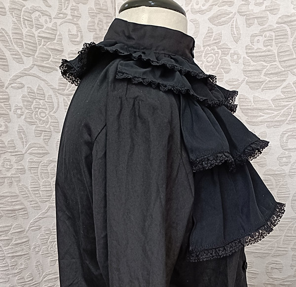 Side view of a black shirt custom made with lace-edged ruffles by Velvet Cherry, Wellington, New Zealand.