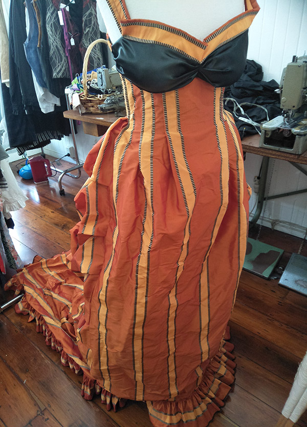 An orange and black late Victorian styled dress custom made by Velvet Cherry, Wellington, New Zealand